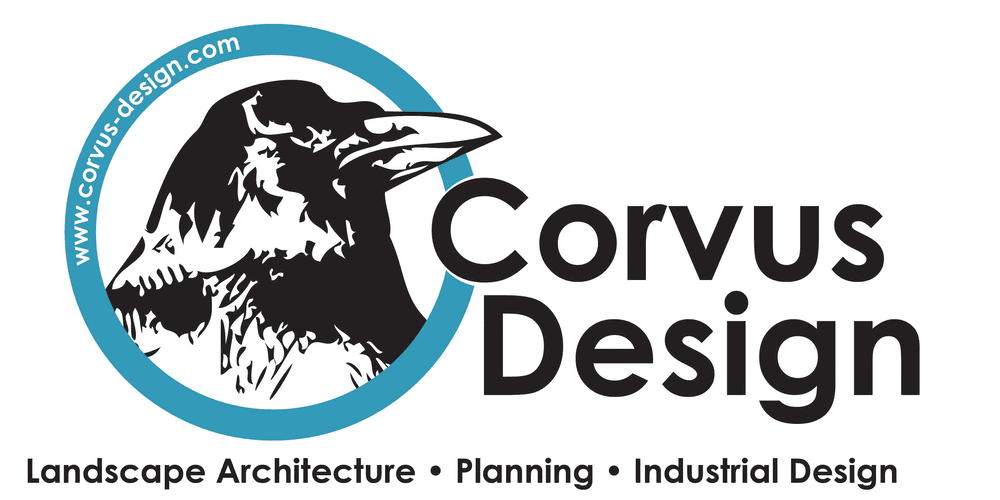 The Corvus Design logo. A back and white illustration of a raven's head is inside a teal blue ring with the URL of the organization typed inside the ring in white. The name of the company, "Corvus Design" is to the right of the raven in the ring, with the C from the word Corvus slightly overlapping the ring. Underneath the entire design are the words "Landscape Architecture • Planning • Industrial Design"